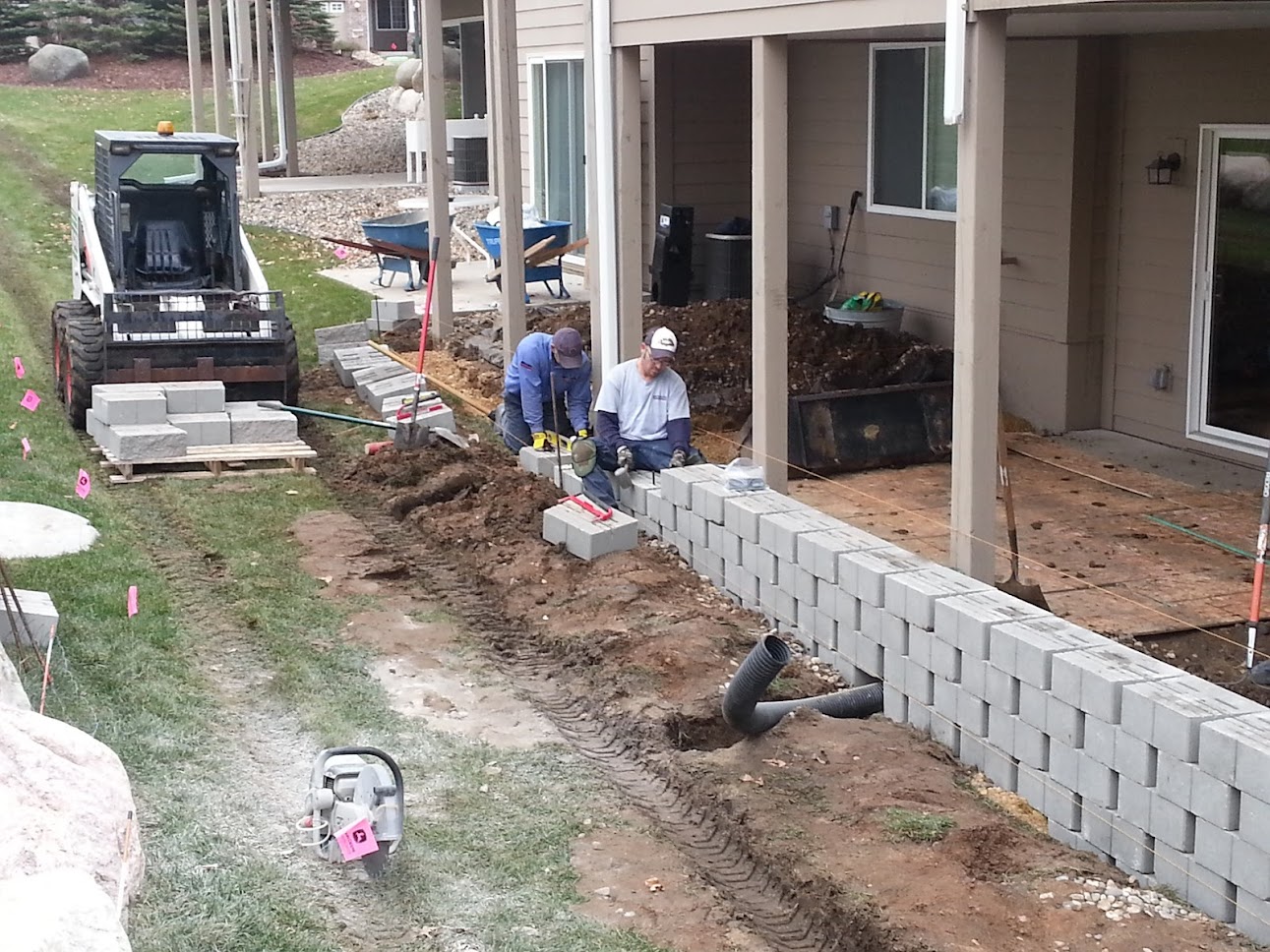 Exterior renovations - landscaping wall and water drainage